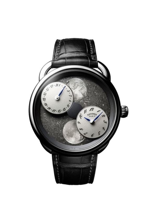 Luxury watch with black leather strap, featuring a celestial design with moon phases and unique dials on the face.