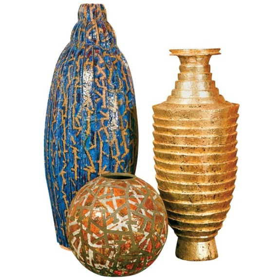 Three ceramic vases in different shapes and colors: blue, gold, and brown with intricate patterns.