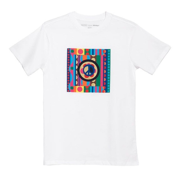 White T-shirt featuring a colorful geometric design with a peace symbol in the center.