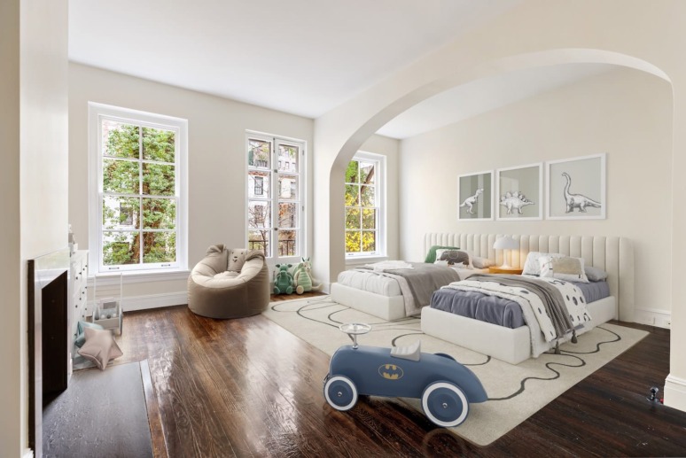 Children's bedroom with twin beds, dinosaur decor, toy car, and large windows overlooking greenery.