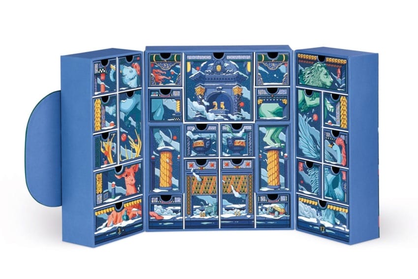 Blue advent calendar with illustrated winter scenes, featuring numbered compartments for each day leading up to Christmas.