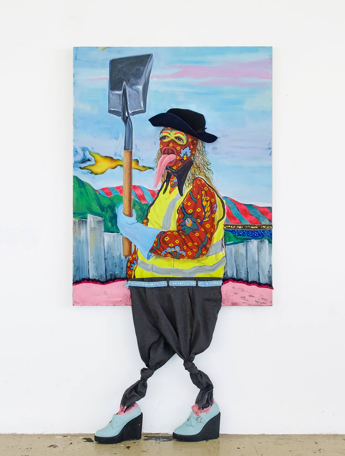 Colorful surreal artwork of a person with a shovel, wearing a hat, wig, and vest, with real shoes and fake legs.