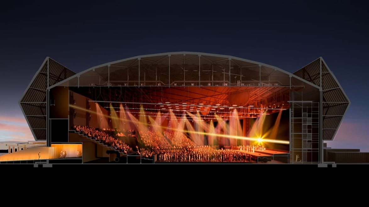 Cross-section of a theater with audience seating and stage lighting, showcasing architectural design and interior layout.