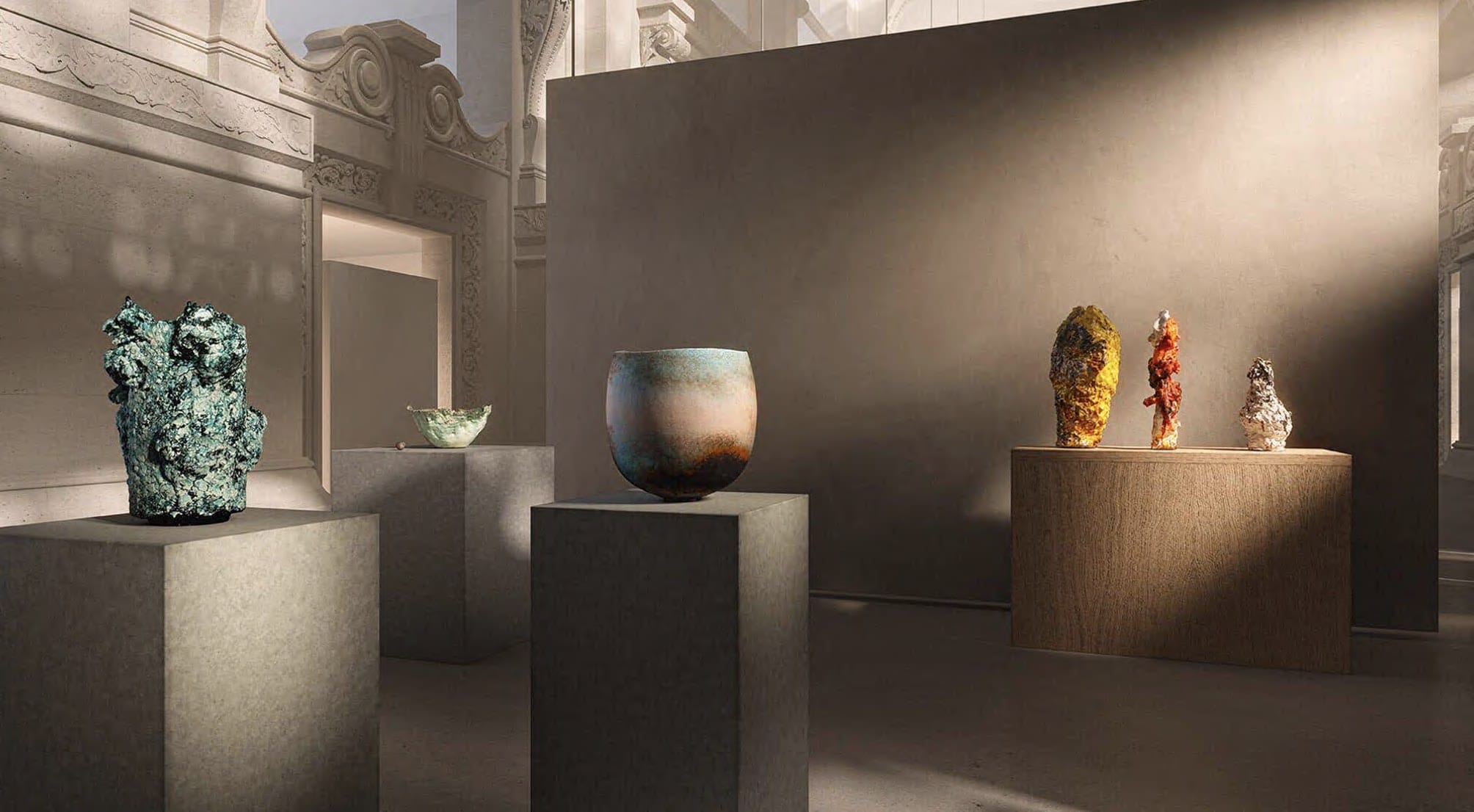 Contemporary ceramic art pieces displayed on pedestals in a modern gallery setting with elegant architecture.
