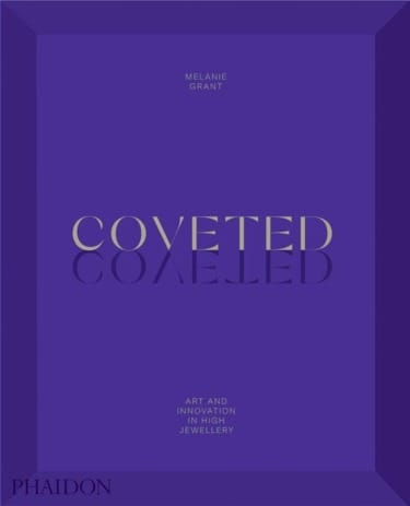 Purple book cover with gold text "Coveted" and subtitle "Art and Innovation in High Jewellery" by Melanie Grant.