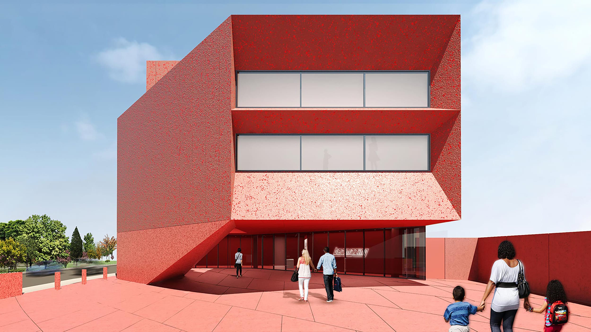 Modern red building with angular design, large windows, and people walking in front on a sunny day.
