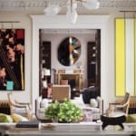 In the living room of a London residence that David Kleinberg Design Associates renovated in collaboration with architecture firm Donald Insall Associates, artworks by Sterling Ruby (left) and Tadaaki Kuwayama frame the view into the library where a mirror by Sam Orlando Miller is mounted above an antique mantelpiece.