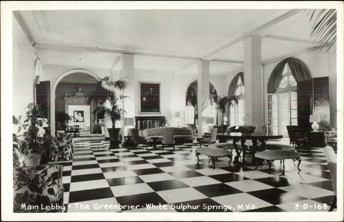 Main lobby of The Greenbrier, White Sulphur Springs, WV, showing classic black and white checkered floor and elegant decor.