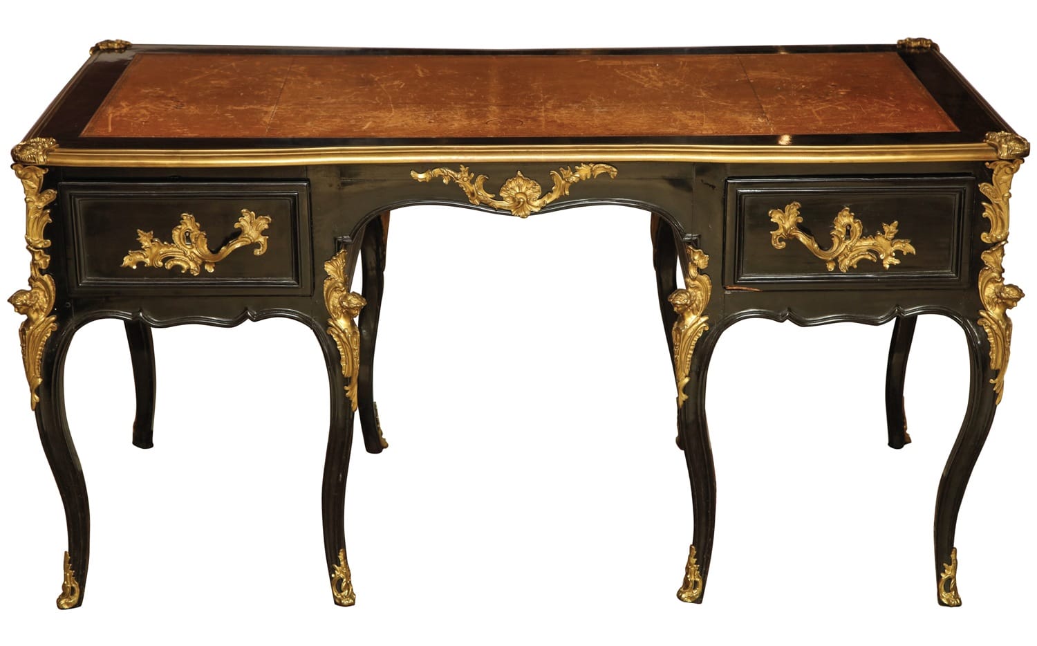 Antique wooden writing desk with ornate carvings and two drawers, featuring a dark finish and gold accents.