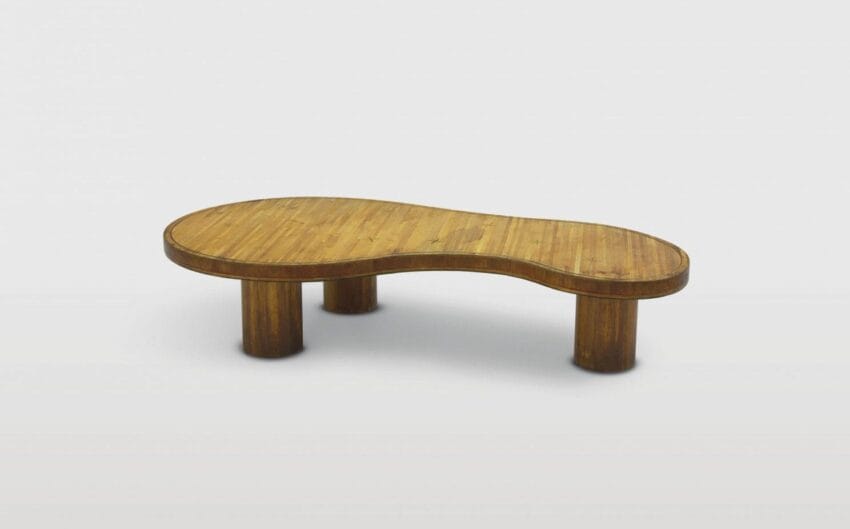 Wooden kidney-shaped coffee table with thick cylindrical legs on a light gray background.