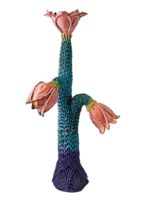 Colorful artistic cactus sculpture with pink flowers and textured blue-green stem on a white background.