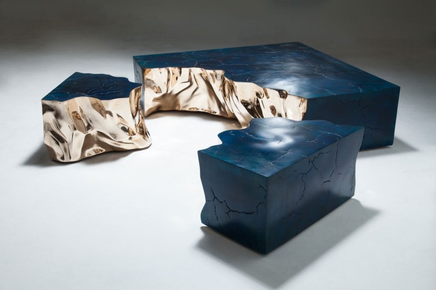 Modern abstract furniture set featuring blue and metallic colors with cracked textures on a light background.