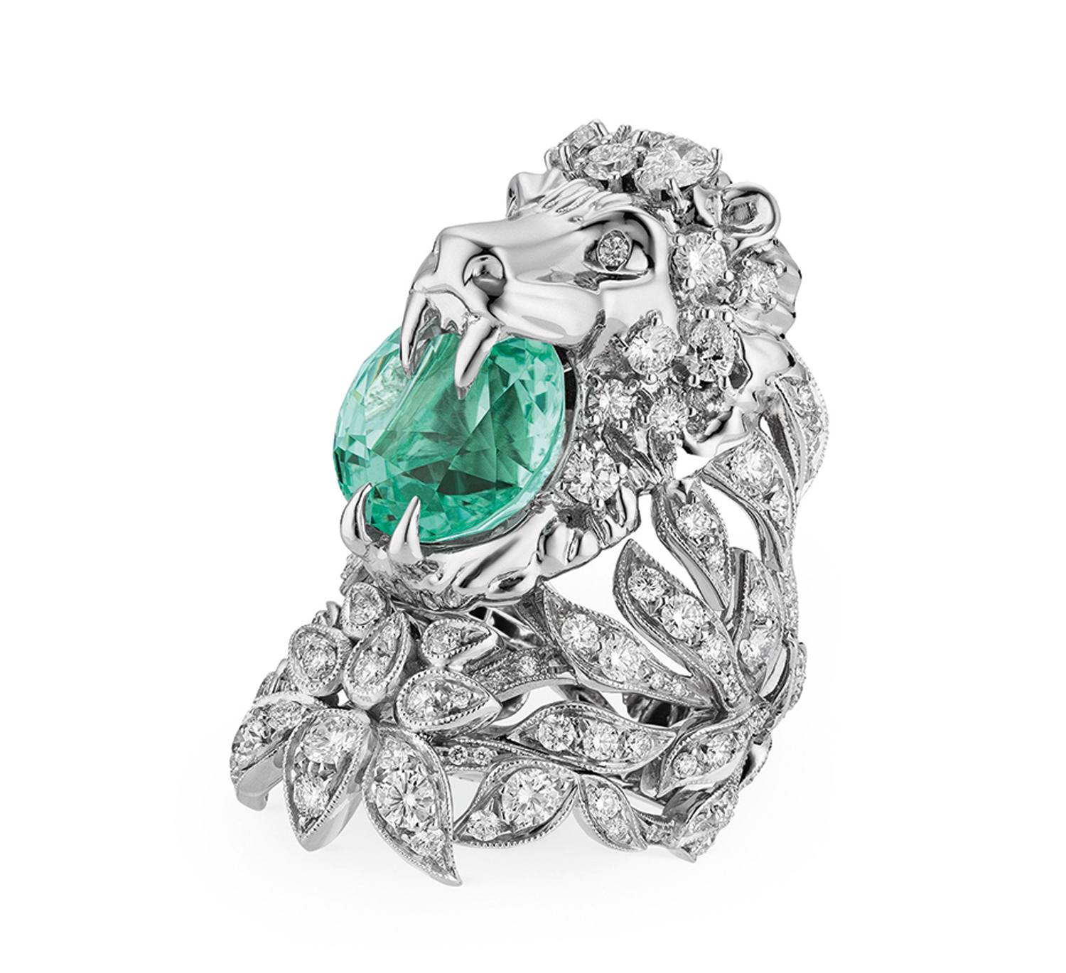 Intricate lion-shaped silver ring with sparkling diamond details and a large green gemstone clasped in its mouth.