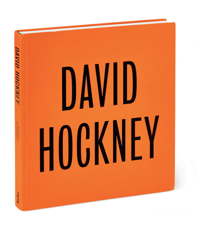 Orange hardcover book titled "David Hockney" standing upright against a white background.