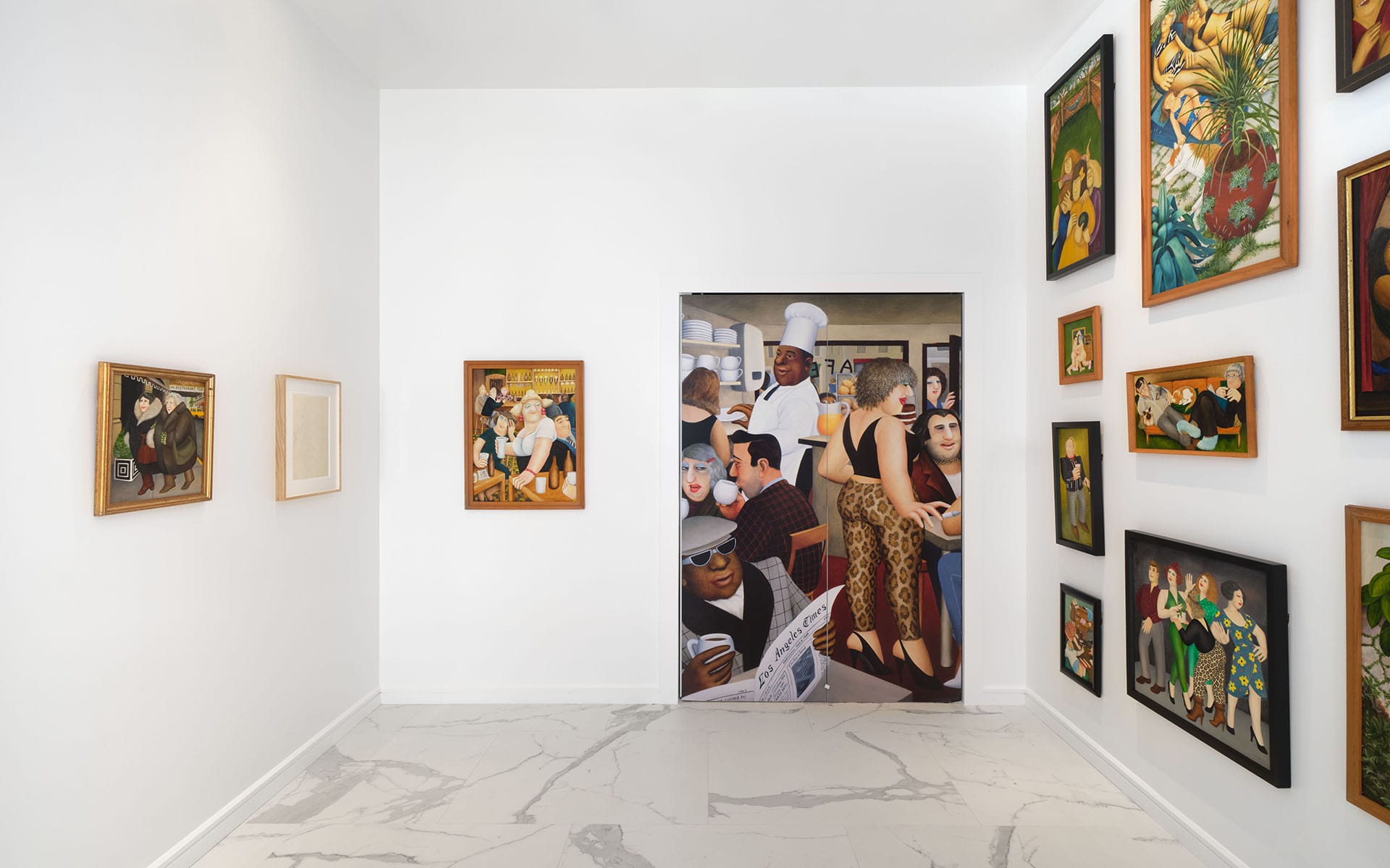 Art gallery interior with colorful, diverse paintings on white walls and a tiled floor.