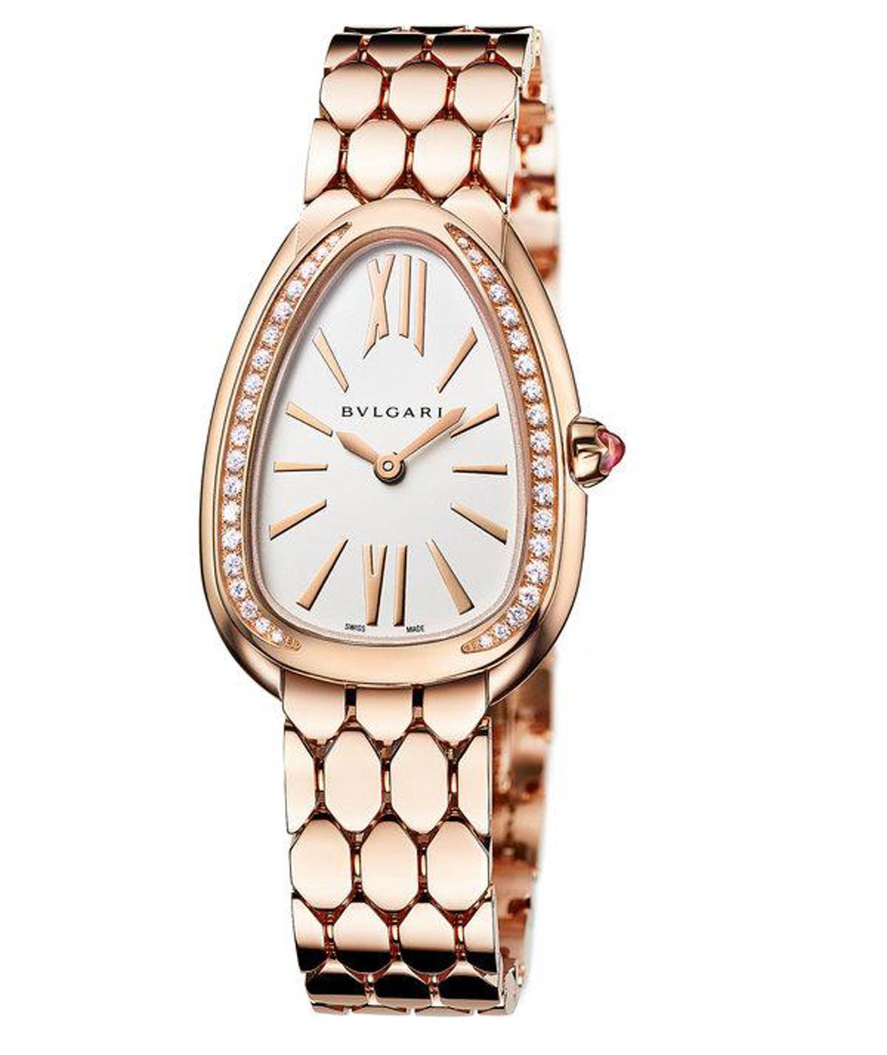 Rose gold serpentine wristwatch with diamond accents and a white face displaying Roman numerals on a luxury brand watch.