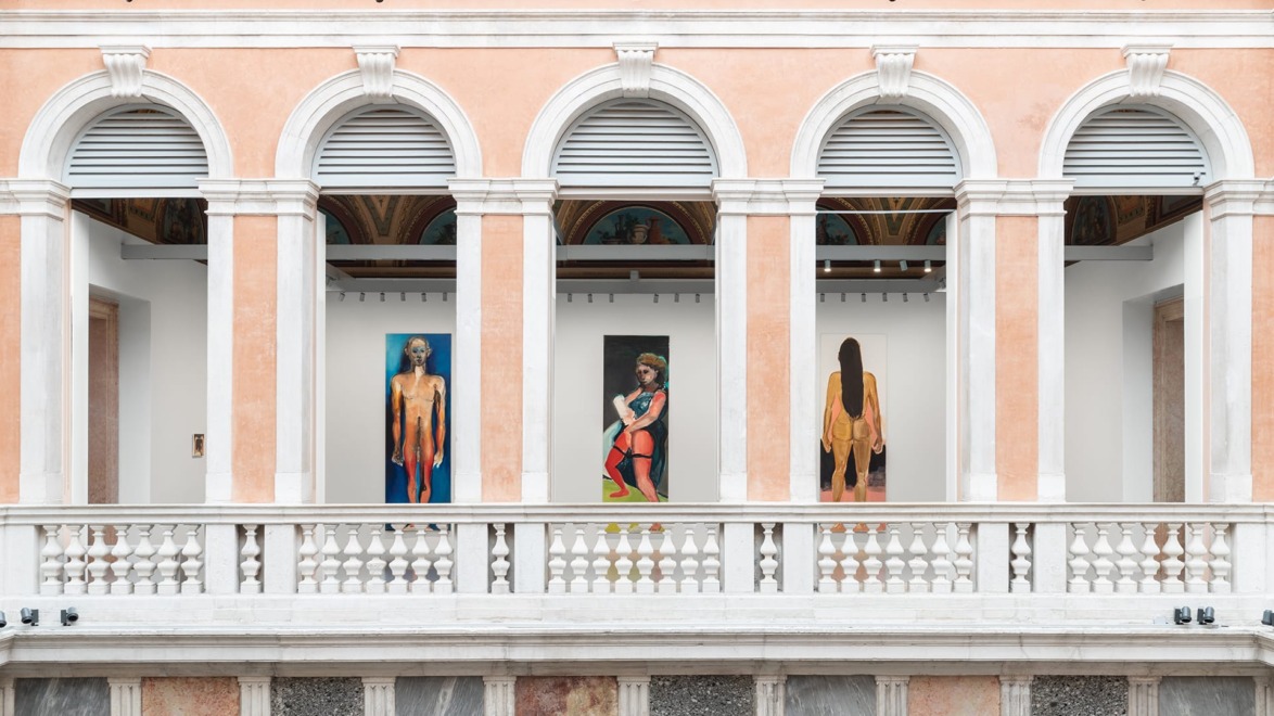 Art exhibition with three large paintings displayed in an elegant building with arches and a white marble balcony.
