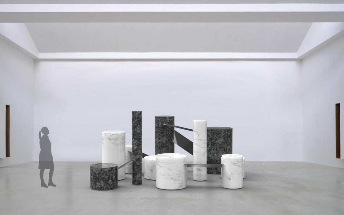Art installation with cylindrical marble structures and a figure silhouette in a modern gallery space with high ceilings.
