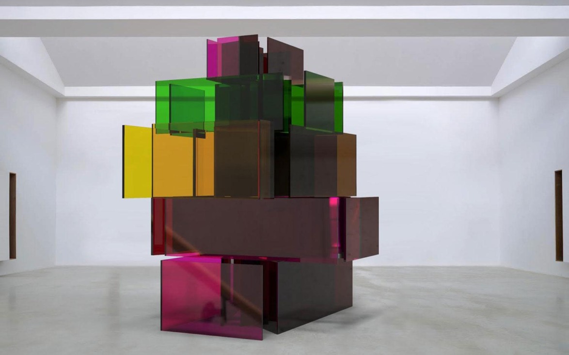 Colorful abstract glass sculpture with overlapping rectangular shapes in a modern gallery setting.