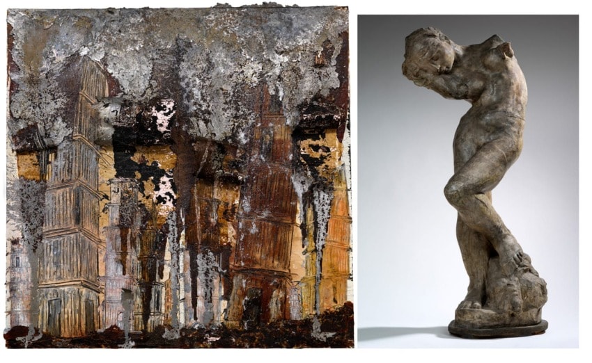 Abstract textured painting with earthy tones beside a weathered stone sculpture of a leaning, partially obscured figure.