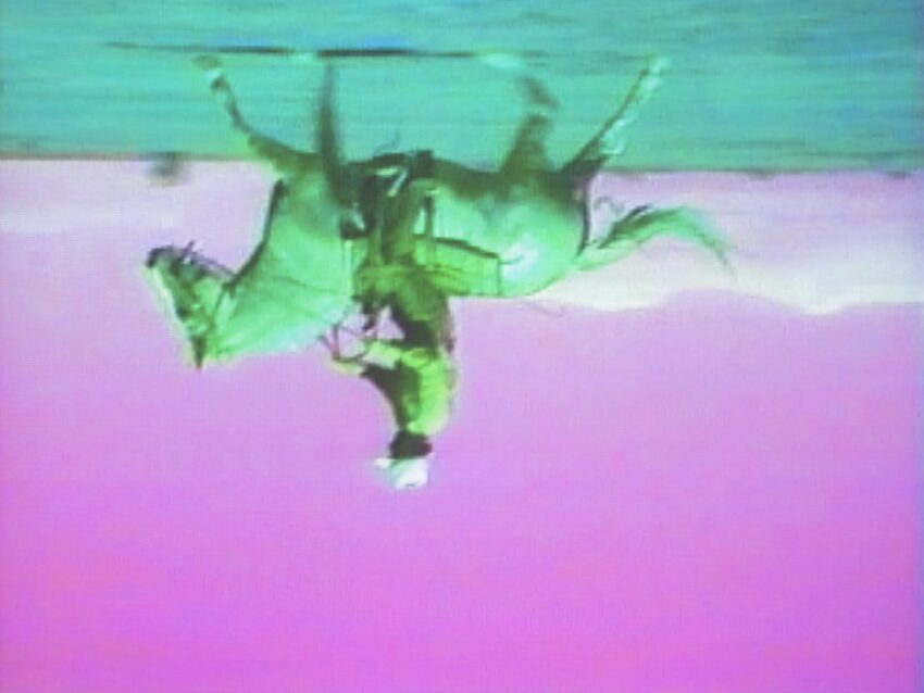 A person riding a horse upside down in a surreal pink and blue landscape.