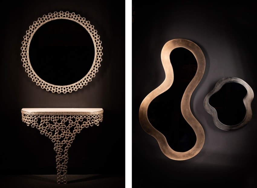 Elegant round mirror with intricate honeycomb design and matching console table; two abstract mirrors on dark wall.