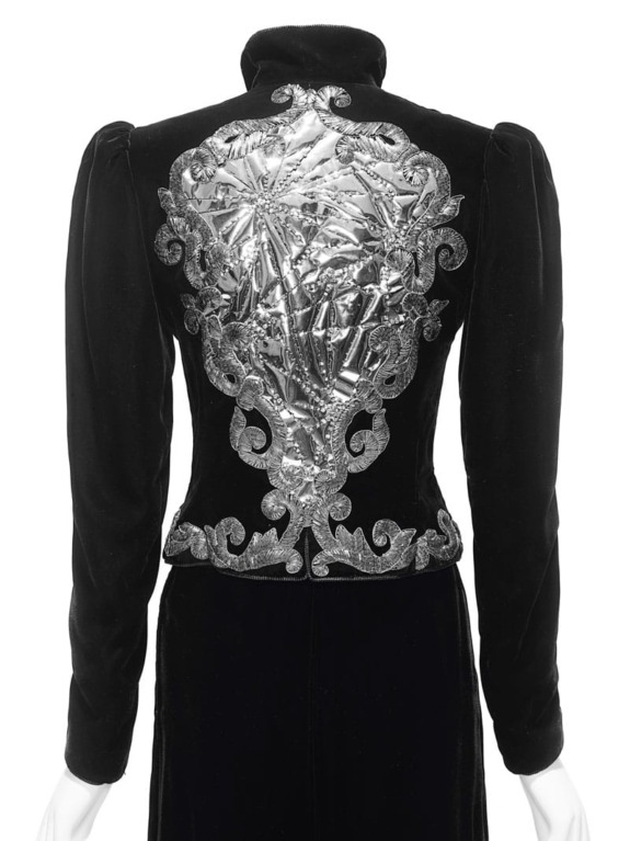 Black velvet jacket with intricate silver embroidery on the back.