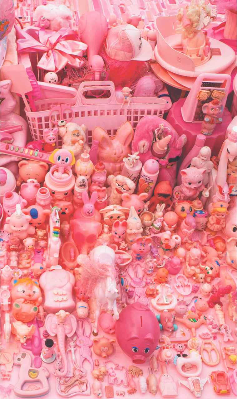 A collection of various pink toys and objects arranged in a vibrant and colorful display.