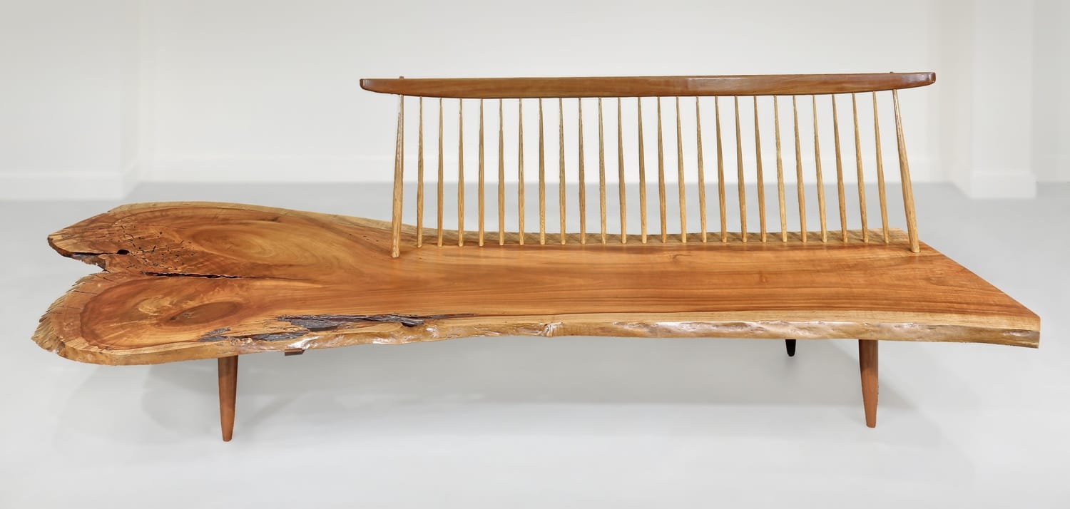 Live edge wooden bench with a spindle backrest, showcasing natural grain and organic shape against a white background.