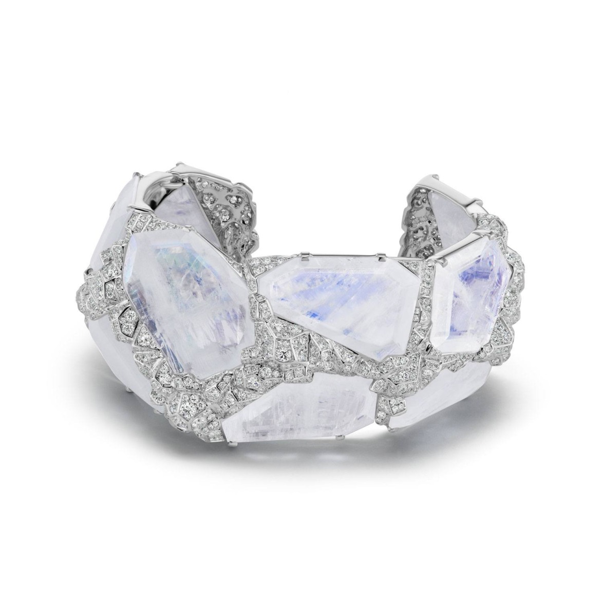 Silver bracelet adorned with iridescent stones and intricate detailing.