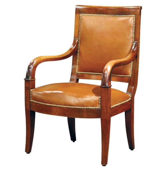 Elegant wooden armchair with tan leather upholstery and nailhead trim.