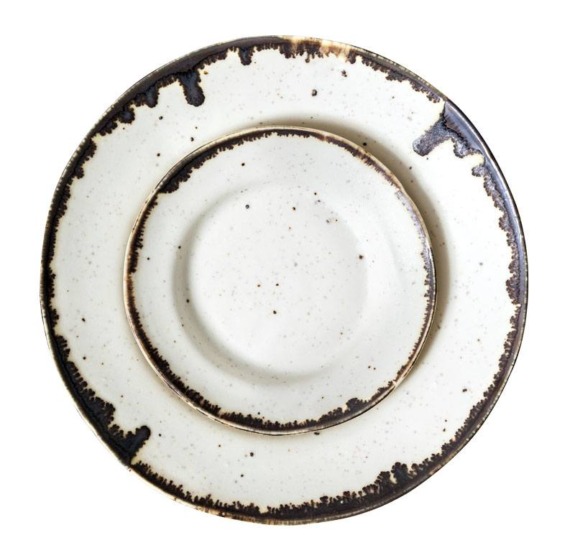 Rustic ceramic dinner plate with a speckled white surface and a brown textured rim.