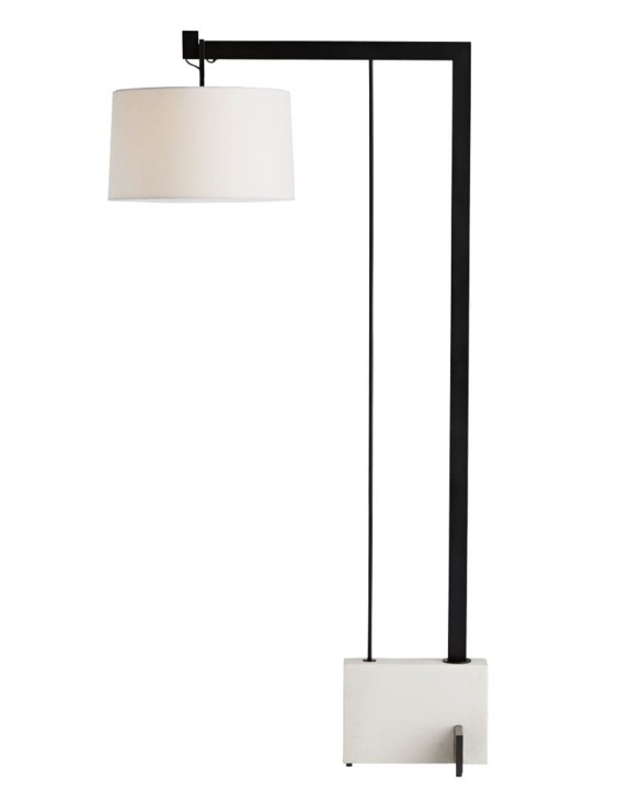 Modern floor lamp with a white cylindrical shade and sleek black stand on a rectangular base.