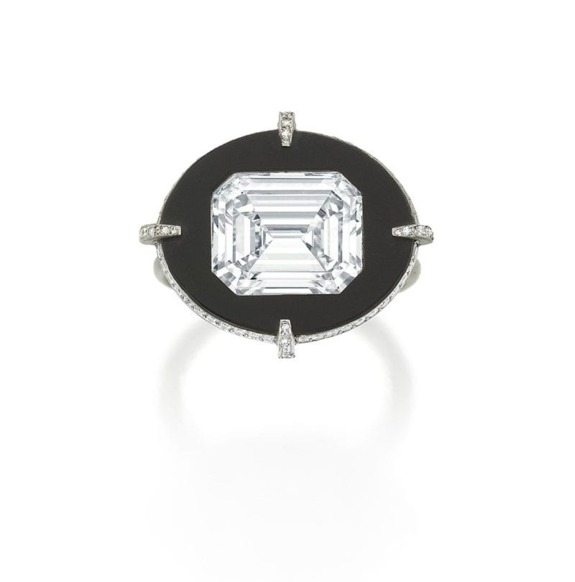 Emerald-cut diamond ring with black onyx halo viewed from top on white background