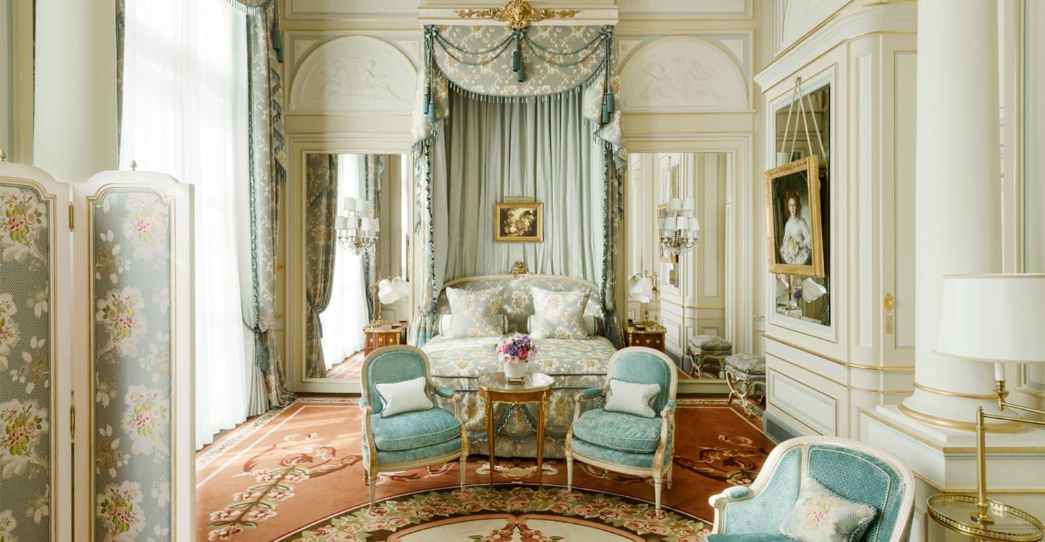 Elegant, luxurious bedroom with ornate furniture, pastel colors, and vintage décor, including a canopy bed and floral accents.