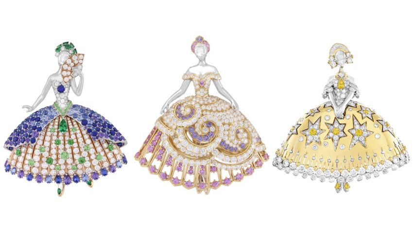 Three elegant ballerina brooches adorned with colorful gemstones and intricate detailing, showcasing exquisite craftsmanship.