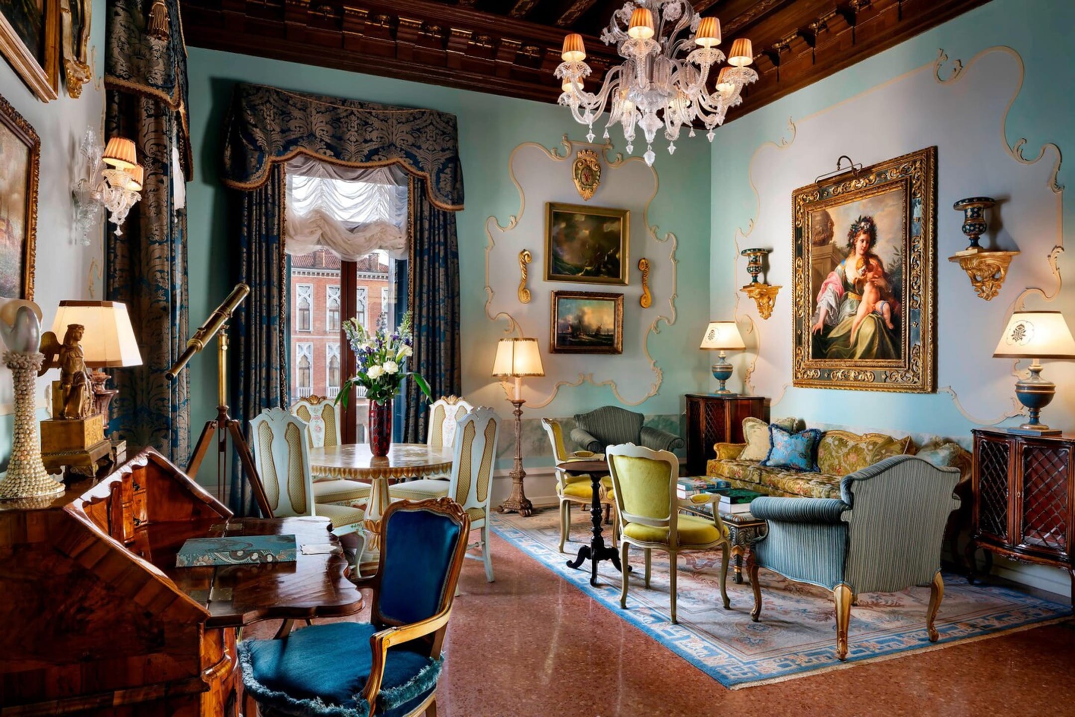 Elegant vintage living room with chandelier, antique furniture, ornate paintings, telescope by window, and rich decor.