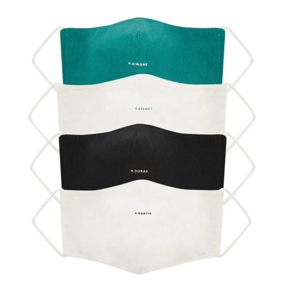 Four face masks stacked vertically, featuring teal, white, black, and white colors with small text on each.
