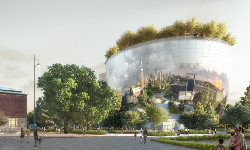 Futuristic, reflective glass building with greenery on top, surrounded by trees and people in a park setting.