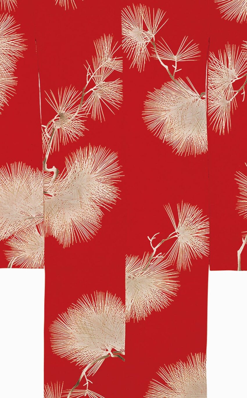 Red and white patterned fabric featuring delicate, detailed pine branch designs.