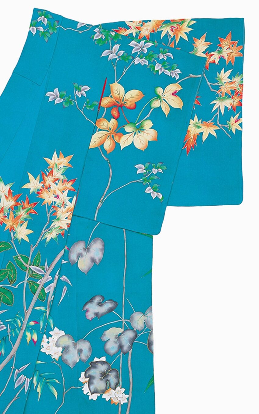 Teal kimono with colorful floral and leaf patterns in autumn hues on a white background.