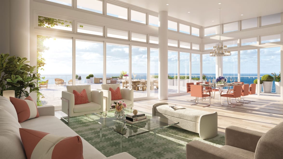 Luxurious open-plan living room with ocean view, featuring modern furniture, large windows, and elegant decor.
