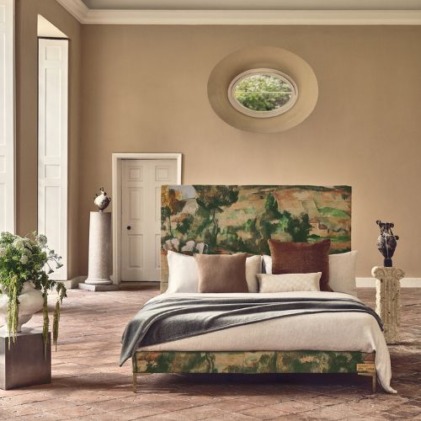 Luxurious bedroom with a nature-inspired headboard, neutral walls, and lush plants, creating an elegant and serene atmosphere.