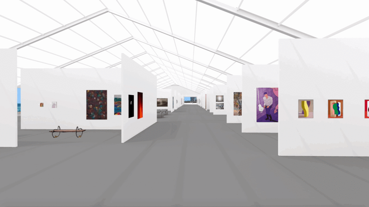 Art gallery interior with white walls showcasing various colorful paintings and a bench along a wide, gray walkway inside.