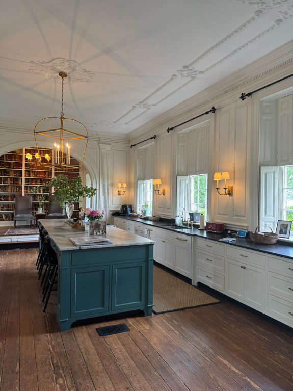 At the end of Westover Plantation’s redesigned kitchen, a former stage has been converted into a library.