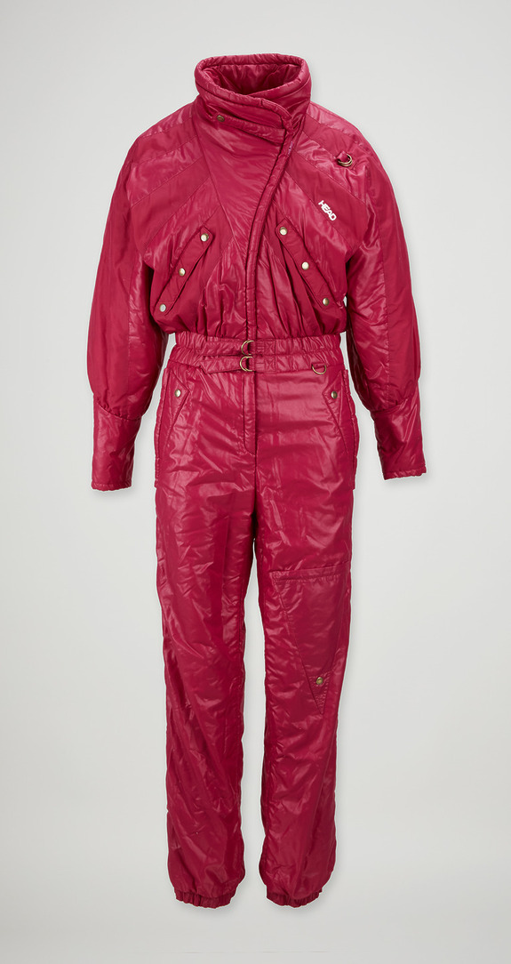Red vintage ski jumpsuit with a quilted design and button details on a plain background.