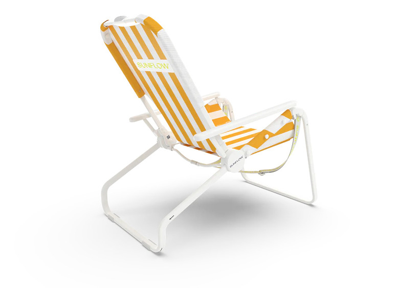 Orange and white striped folding beach chair with metal frame and padded armrests viewed from the side.