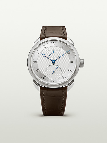 Elegant wristwatch with silver dial, blue hands, brown leather strap, and date display at 6 o'clock position.