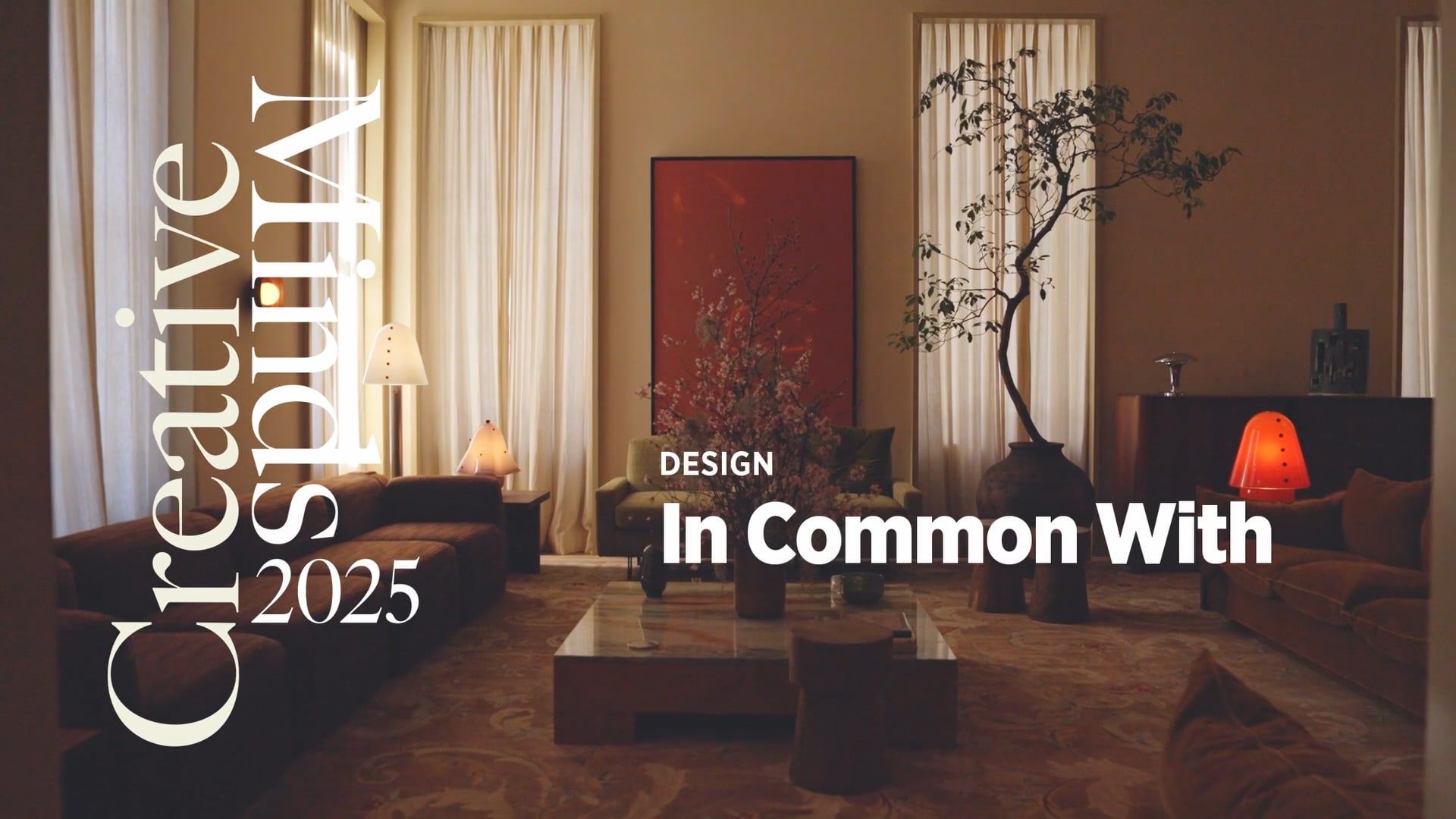 Stylish interior with modern furniture, warm lighting, large artwork, tree, and text "Creative Affairs 2025 Design In Common With"