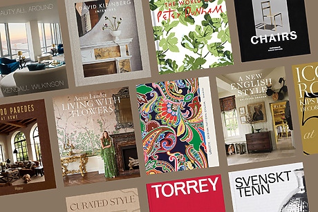 A collage of various colorful interior design book covers displayed on a brown background.